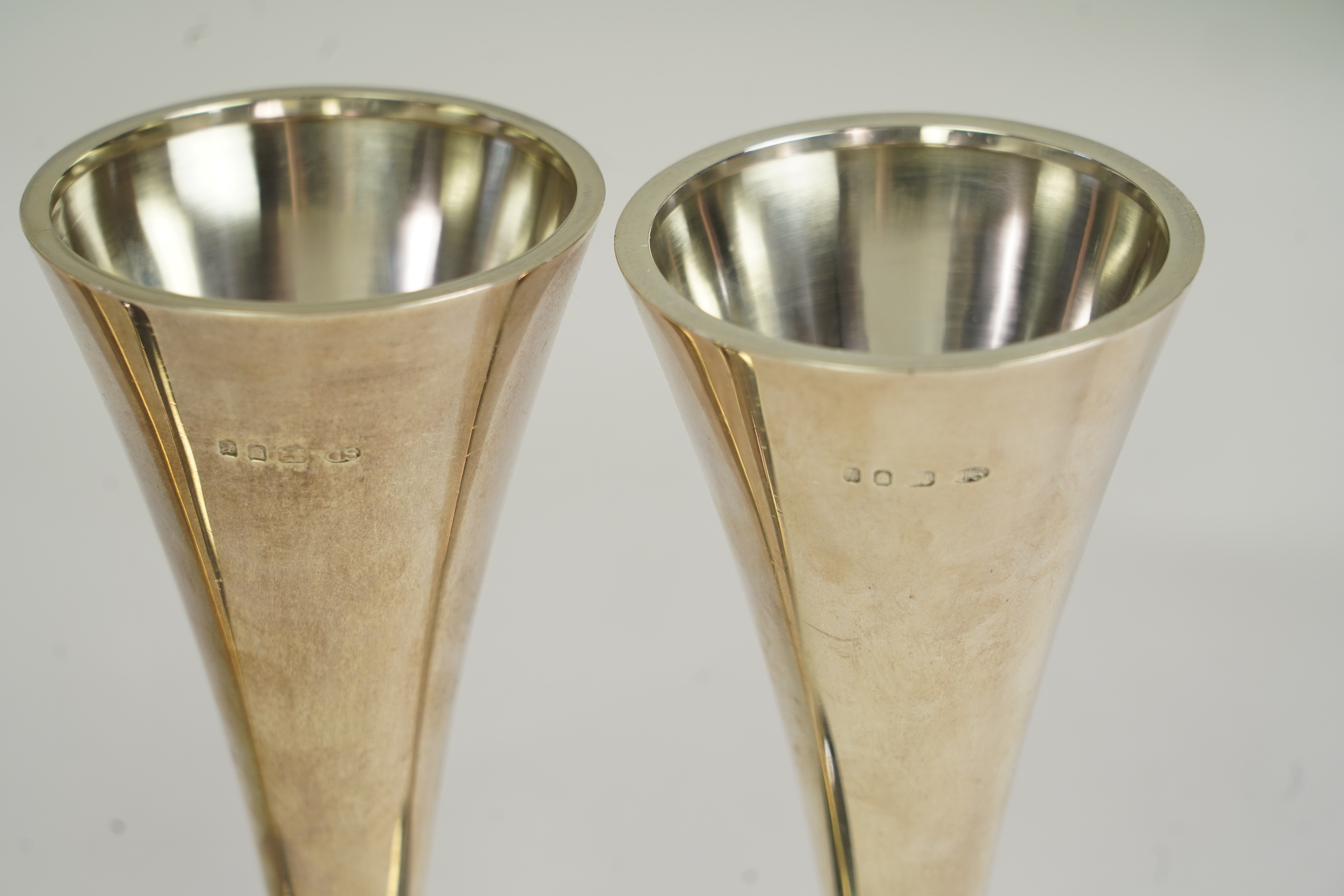 Two pairs of Elizabeth II Stuart Devlin silver candlestick bases